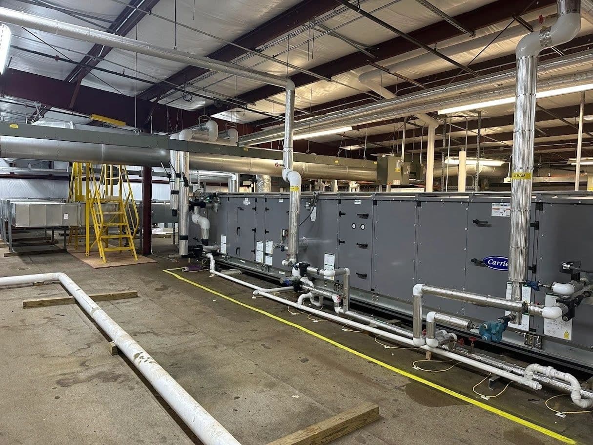 Air-handling equipment with connected ductwork and piping